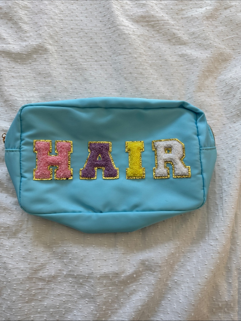 Blue Cosmetic Pouch with Colorful 'HAIR' Letters